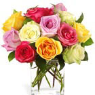 Catch someone's eye with this contemporary bouquet of one dozen assorted color roses nestled in a clear glass vase, rectangle or cube. Compact, beautiful, and sure to please. Popular for birthdays, love, anniversaries, thanks, and thinking of you. Same day and next day nationwide florist delivery.