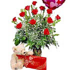 Say 'I Love You' with this sure-fire combination. One dozen beautiful red roses arranged with accents, a lovable teddy bear, chocolates, and a mylar balloon too. You're sure to make quite an impression!