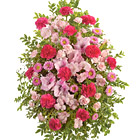 Convey your heartfelt sympathy and support with this soft and pretty pink standing spray of fresh carnations, gladioli, alstroemeria, asters, or similar seasonal favorites. A thoughtful and comforting expression of caring. Appropriate for wakes, funerals, and memorial services. Local florist design and delivery across the USA and Canada.