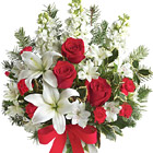 Send jolly holiday wishes with this beautiful vased arrangement of red roses and miniature carnations combined with white lilies, alstroemeria, and other seasonal blooms and trimmed with a festive bow. Glorious! Available after Thanksgiving through Christmas. Professional florist design and delivery in the USA and Canada.